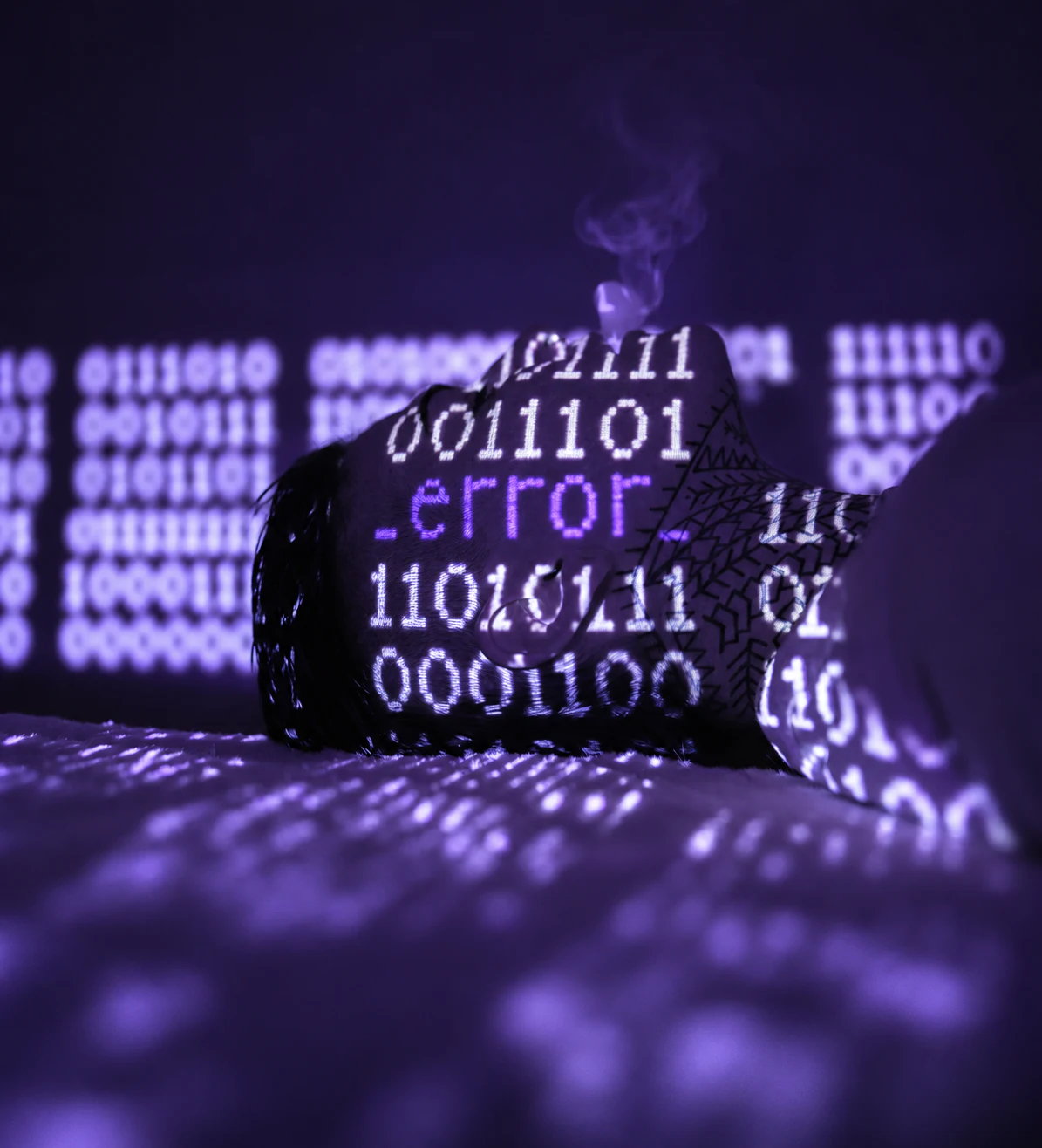 A violet-lit face studies a projected error message against a dark background.